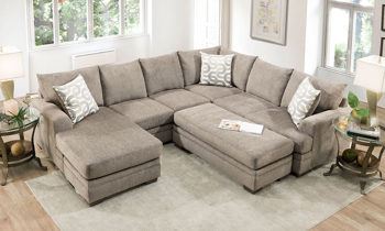 Croft Sand Reversible Chaise Sectional Sand-colored fabric upholstered chaise sectional with coordinating throw pillows.